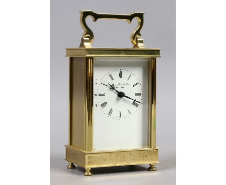 A brass cased quartz carriage clock with enamel dial signed James Porter & Son.