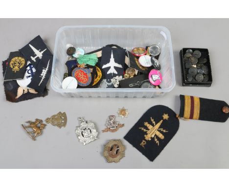 A box of military related badges, brass buttons and enamel badges