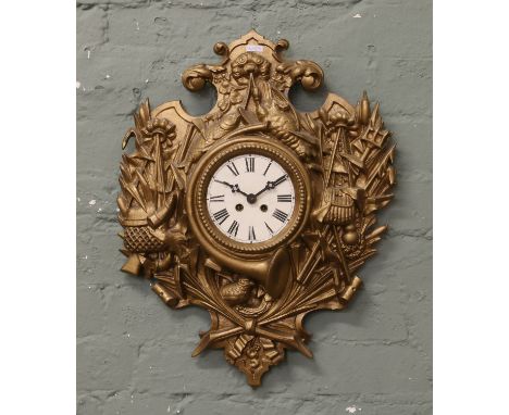 An antique gilt metal Cartel wall clock decorated in relief with game and hunting motifs housing a two train movement strikin