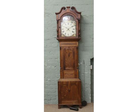 A Victorian oak and mahogany 31 hour long case clock with painted dial date chapter by Lomas Swanwick complete with single we