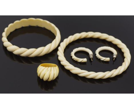 Carved Ivory twist pattern jewellery group. C.1960 includes a ring and bangle another bangle and a pair of hoop earrings all 