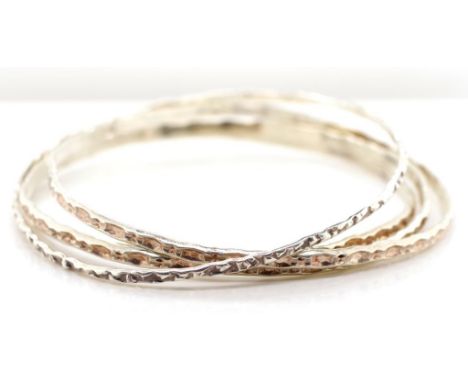 Four sterling silver bangles marked silver approx 65mm inside diameter, weight 22 grams. As well as a filigree butterfly broo