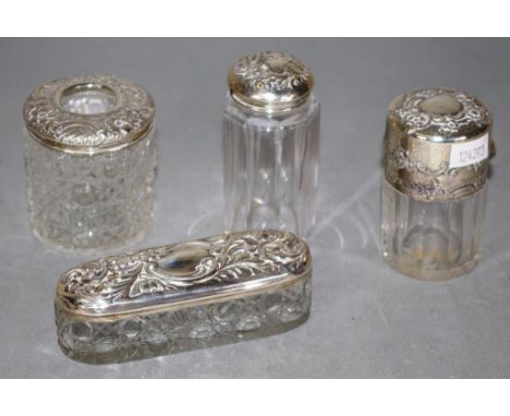 Two various sterling silver topped toilet jars including George V sterling topped crystal jar; and sterling silver topped hai