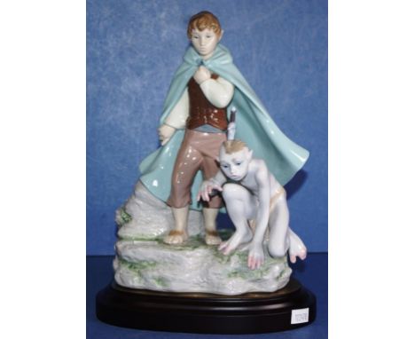 Lladro "Frodo and Gollum" figurine on a timber stand, from the Lord of the rings collection, edition: 119/500, signed Escup. 