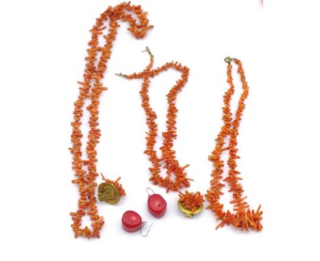 A collection of coral beaded jewellery include earrings and necklaces. One clasp marked 333 for 8ct gold.