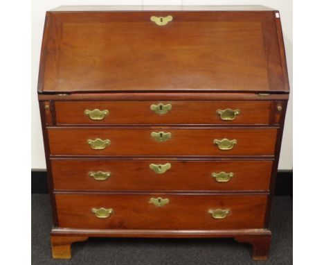 Gerogian Chippendale style mahogany bureau with fall front opening to reveal a fitted interior of pigeon holes, short drawers