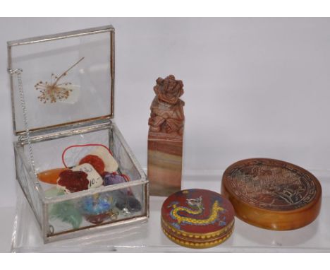 Collection Chinese carved mementos including carved horn pendant, figure decorated; cloisonne pill box; carved hardstone chop