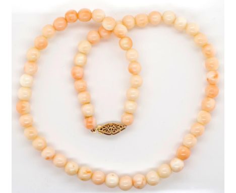 Vintage coral and gold necklace approx 6.6mm round beads, 40cm necklace length. Marked 14kt gold clasp