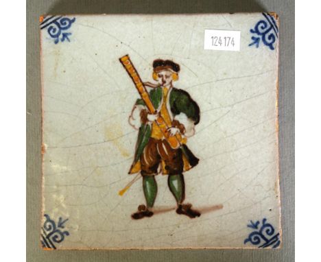 Antique Delft ceramic tile depicting a musician. 13cm approx, square.