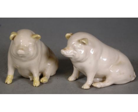 Pair Belleek ceramic pig figures green mark to bases, (height 7cm approx, each).