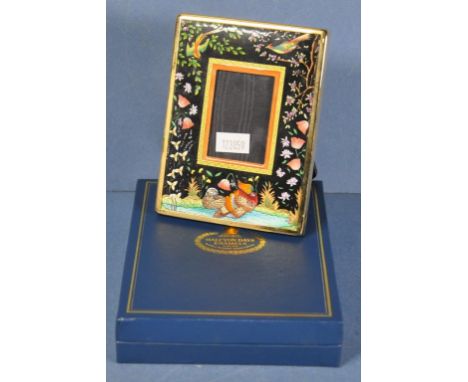 Boxed Halcyon Days enamel photo frame enamel quail and floral decoration. In original presentation box. (11.5cm X 9cm approx.
