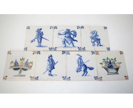 Seven vintage Delft ceramic tiles 5 tiles, blue and white figure decorated; 2 tiles decorated with fruit. Marked 'Workum' to 