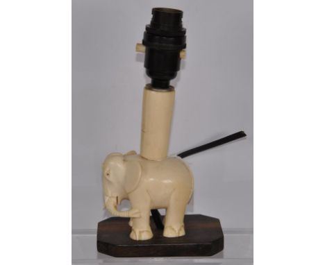 Art Deco carved ivory elephant form lamp carved ivory elephant electric lamp, C:1930. (requires rewiring for use), on wood ba