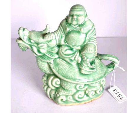 Chinese decorated ceramic wine jug man riding dragon, green glaze decoration, impressed character mark to base. (height 18cm 