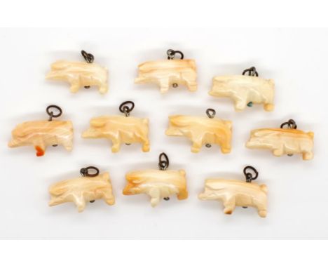 Ten carved coral charms all of pig form. Approx 22.5mm x 8.3mm
