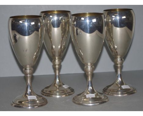Set four USA sterling silver goblets marked to bases & # 762, monogrammed, gilt washed interiors. Height 21cm approx, each. W