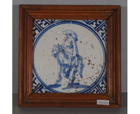 Framed antique Delft ceramic tile blue & white figure on horseback. (Some glaze losses). 13cm approx, square, tile.