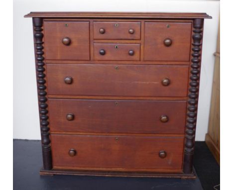 Victorian cedar chest of drawers with 4 small over 3 long drawers flanked by bobbin turned columns, 129cm wide, 55cm deep, 12