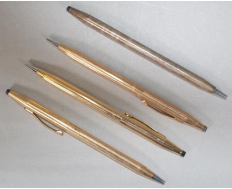 Four gold plated ballpoint pens