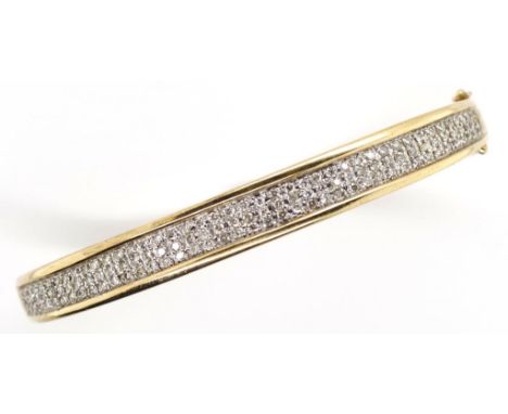 Diamond cluster and 9ct gold bangle of tapered court form, with a hinge, clasp and double safety catch marked 375 approx weig