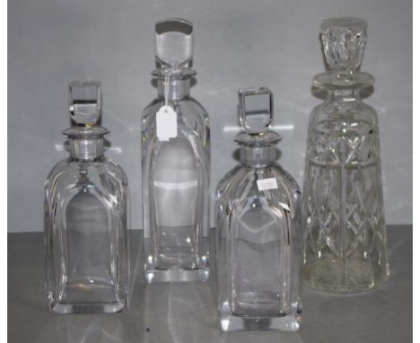 Three Orrefors crystal spirit decanters each with inscribed mark to base, (height 25cm (pair), and 29cm approx); together wit