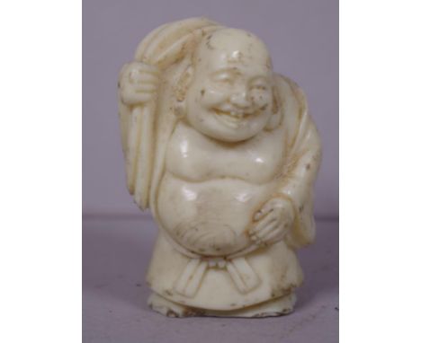 Japanese netsuke standing man figure. Height 5cm approx.