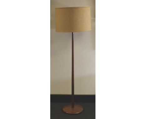 Turned wooden standard lamp with solid wood base and wooden bun pads. 170cm tall. 70cm diameter shade.