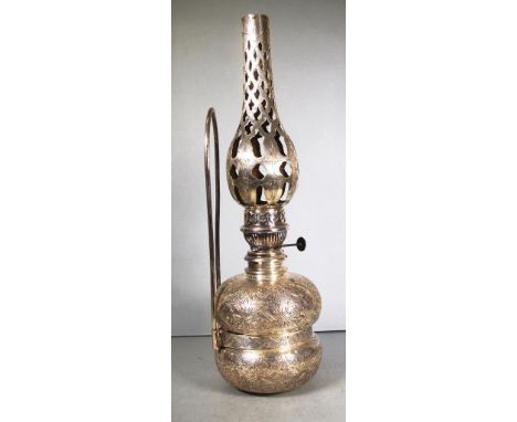 Egyptian silver oil lamp with heavily engraved decoration and pierced chimney, all components stamped Cairo .900 silver, 1182