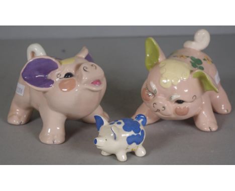 Pair Kay Finch USA ceramic pig figures hand painted floral decoration, marked to bases. (Height 9cm approx, each); together w
