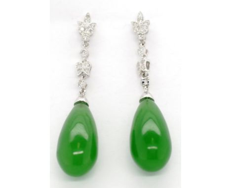 Jade, diamond and 18ct gold drop earrings Approx 18.5mm tapering drop cut jade. Set on a white gold and diamond leaf and beze