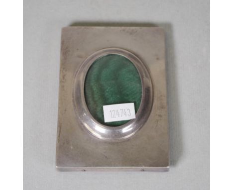George V sterling silver photo frame Birmingham 1910, maker's mark rubbed. (10cm X 7cm approx, with oval shape for image).