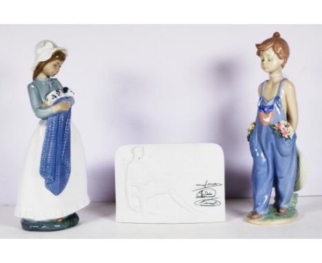 Lladro 1997 Collectors Society boy figure Standing Boy, marked to base and # 7650, (height 26cm approx); together with a Nao 