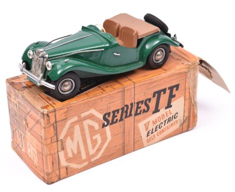 A Victory Industries 1:18 scale battery operated model of an MG TF convertible. Moulded plastic body in green, with brown sea