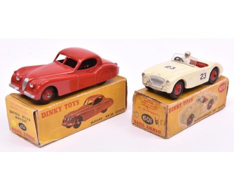 2 Dinky Toys. Jaguar XK120 Coupe (157). An example in bright red with red wheels. Plus an Austin-Healey '100' Sports (109). A