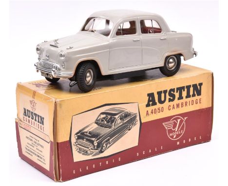 A Victory Industries 1:18 scale battery operated model of an Austin A40/50 Cambridge. Moulded plastic body in grey, with red 