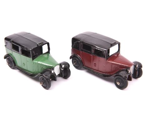 2 Dinky Toys TAXI (36g). An example in maroon and black and another in green and black, both with black wheels and tyres. One