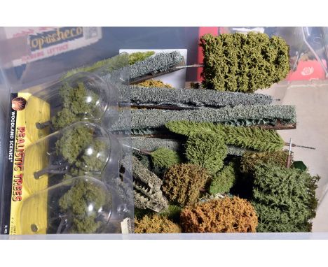 A quantity of early O gauge and Gauge One lineside items and figures by Hornby, Britains, Charbens, etc. Including; a large s