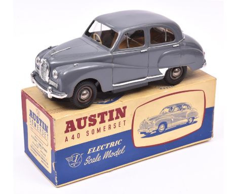 A Victory Industries 1:18 scale battery operated model of an Austin A40 Somerset. Moulded plastic body in grey, with brown in