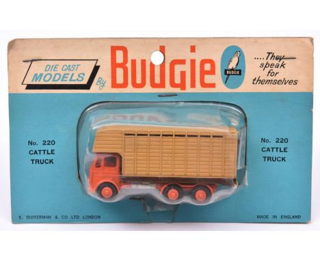 A rare Budgie Leyland Cattle Truck No.220. In orange with light brown rear body. An example mounted on a blue/white backing c