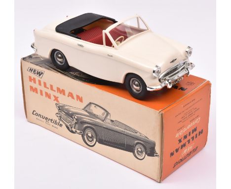 A Victory Industries 1:18 scale battery operated model of a Hillman Minx convertible. Moulded plastic body in ivory, with red