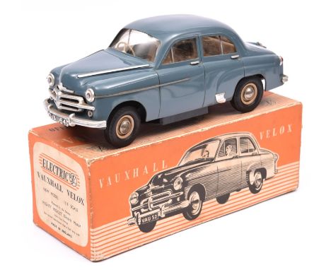 A Victory Industries 1:18 scale battery operated model of a Vauxhall Velox. Moulded plastic body in blue-grey, with brown int