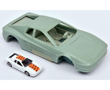 A Large Scale Resin Prototype Mould for a Corgi Juniors Ferrari Testarossa. Length 22.5cm. Together with a production example