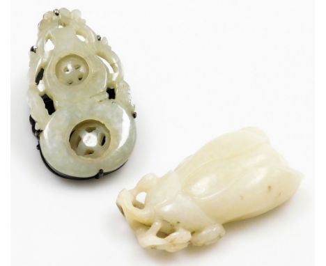 A Chinese white jade carving of a flower, 6.5cm high, together with a jade and white metal paper clip of gourd form, with eng