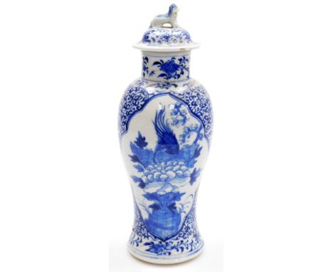 A 19thC Chinese porcelain baluster vase and cover, the lid with dog of fo finial, decorated in blue and white with reserves o