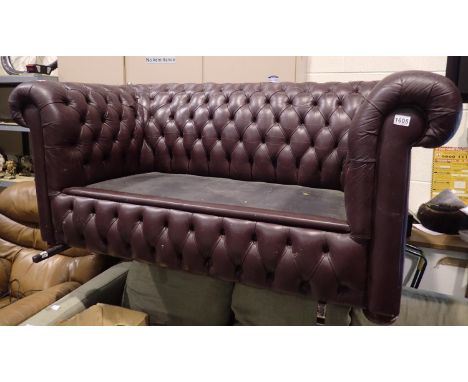 Oxblood leather Chesterfield style two seater sofa, lacking seat cushions, L: 170 cm. Not available for in-house P&amp;P 