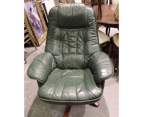 Green leather Stressless reclining armchair. All electrical items in this lot have been PAT tested for safety and have passed