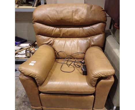 G plan tan leather electric reclining armchair. All electrical items in this lot have been PAT tested for safety and have pas