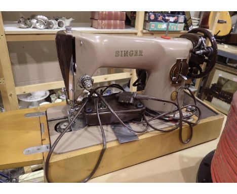 Cased Singer electric sewing machine. All electrical items in this lot have been PAT tested for safety and have passed. This 