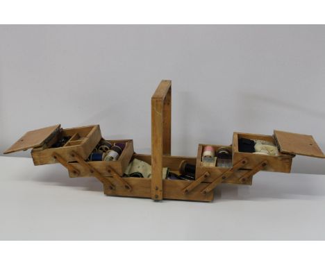 A vintage wooden sewing box and contents 