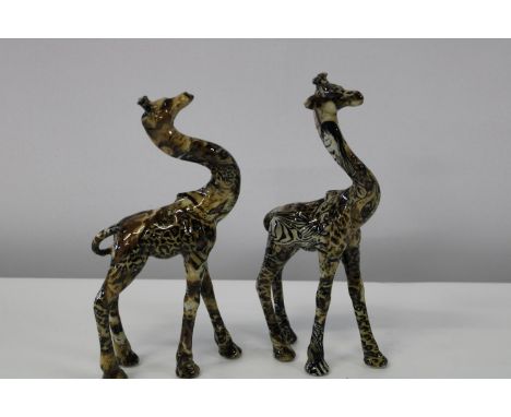 Two Collage safari ceramic giraffe figurines 
